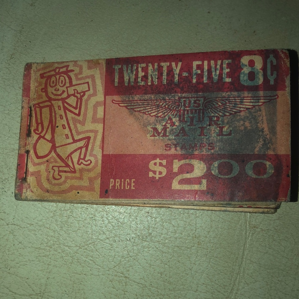 Vintage 1960’s 8 cent Air Mail Stamps in book